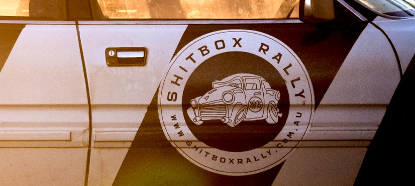Shitbox Rally logo on a car